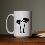 Palm trees waterproof vinyl decal sticker on a coffee cup.