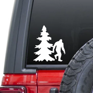 Sasquatch bigfoot yeti in forest with tree waterproof vinyl decal sticker on a car window.