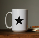 Star waterproof vinyl decal sticker on a coffee cup.