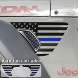 Black american flag with blue center line fender vent decal on a jeep wrangler.