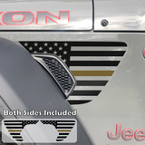 Black American flag with gold center line fender vent decal on a jeep wrangler.