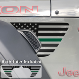 Black American flag with green center line fender vent decal on a jeep wrangler.