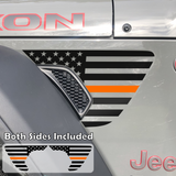 Black American flag with orange center line fender vent decal on a jeep wrangler.